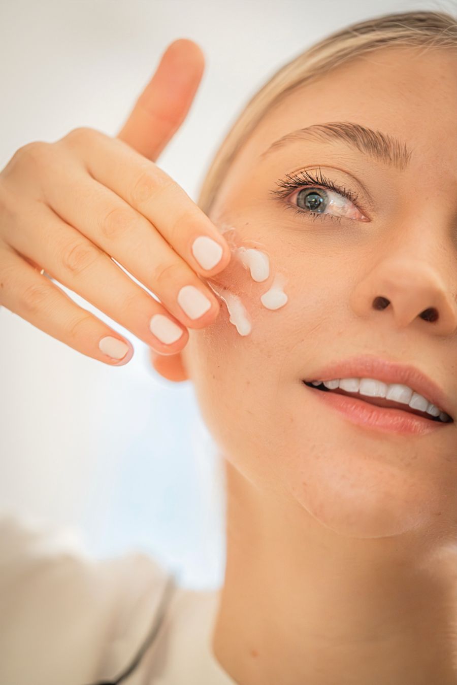 A glowing client after a skincare treatment